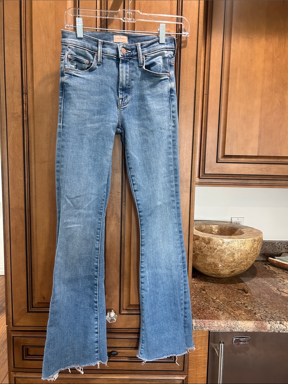 MOTHER Light Blue High-Rise Flare Jeans with Frayed Hem